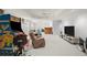 Recreational basement area with arcade games, a TV, and comfortable seating at 5204 Tealing Ne Dr, Roswell, GA 30075