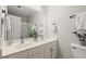 Bathroom featuring a double vanity with modern fixtures and a walk-in shower at 5204 Tealing Ne Dr, Roswell, GA 30075