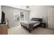 Bedroom with carpet flooring, a window, a ceiling fan and ample closet space at 5204 Tealing Ne Dr, Roswell, GA 30075