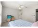 Bedroom with a window and a ceiling fan, featuring carpet flooring at 5204 Tealing Ne Dr, Roswell, GA 30075