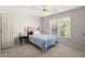 Bedroom with a window and a single bed with a wooden headboard at 5204 Tealing Ne Dr, Roswell, GA 30075