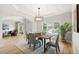 Formal dining room featuring modern decor, natural light, and seamless flow into the adjacent living areas at 5204 Tealing Ne Dr, Roswell, GA 30075