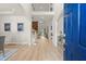 Bright foyer boasts a soaring ceiling, white walls, hardwood floors, and an elegant staircase at 5204 Tealing Ne Dr, Roswell, GA 30075