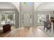 Spacious foyer with hardwood floors, white trim, archways, and views into the living spaces at 5204 Tealing Ne Dr, Roswell, GA 30075