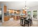 Spacious kitchen features stainless steel appliances, an island with seating, light-colored cabinetry and an eat in area with deck access at 5204 Tealing Ne Dr, Roswell, GA 30075