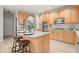 Charming kitchen features stainless steel appliances, granite counters, light-colored cabinetry and lots of natural light at 5204 Tealing Ne Dr, Roswell, GA 30075
