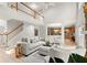 Bright and open living room with high ceilings, a stone fireplace, and hardwood floors at 5204 Tealing Ne Dr, Roswell, GA 30075