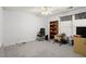 Neutral office space with a bookshelf and a large window for natural light at 5204 Tealing Ne Dr, Roswell, GA 30075