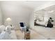 An airy sitting room leads into the the main bedroom with neutral decor creating an inviting atmosphere at 5204 Tealing Ne Dr, Roswell, GA 30075