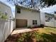 A fenced-in backyard features a patio with shade and lawn at 5345 Mountain Top Pl, Cumming, GA 30041