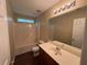 Bathroom featuring laminate flooring, and a combined shower and bathtub at 5345 Mountain Top Pl, Cumming, GA 30041