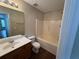Well-lit bathroom features modern fixtures and a tub with shower at 5345 Mountain Top Pl, Cumming, GA 30041