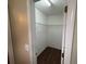 Walk-in closet featuring wood floors and ample shelving for organized storage at 5345 Mountain Top Pl, Cumming, GA 30041