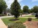 This home features a well-manicured front lawn and tree-lined street at 5345 Mountain Top Pl, Cumming, GA 30041