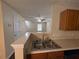 Kitchen sink area with modern fixtures and a view of the living room at 5345 Mountain Top Pl, Cumming, GA 30041