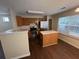 Functional kitchen with stainless steel appliances, wooden cabinets, and a convenient center island at 5345 Mountain Top Pl, Cumming, GA 30041