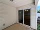 A covered patio with sliding glass doors leads into a well-lit kitchen at 5345 Mountain Top Pl, Cumming, GA 30041