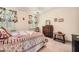Cozy bedroom with floral bedding, natural light, and charming decor creates a relaxing space at 3196 Henderson Walk, Atlanta, GA 30340