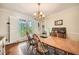 Charming dining room with wooden table, chandelier, and natural light at 3196 Henderson Walk, Atlanta, GA 30340