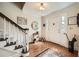 Inviting foyer with hardwood floors, staircase, and elegant decor at 3196 Henderson Walk, Atlanta, GA 30340