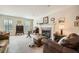 Bright living room with a fireplace, plush seating, and large windows at 3196 Henderson Walk, Atlanta, GA 30340