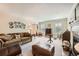 Comfortable living room with a fireplace, plush sofa, and classic furnishings at 3196 Henderson Walk, Atlanta, GA 30340