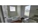 Bathroom featuring a soaking tub, separate shower, and double vanity with granite countertops at 341 Brookside Dr, Mcdonough, GA 30253