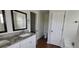Bathroom featuring a double vanity with granite countertops, soaking tub and tile floors at 341 Brookside Dr, Mcdonough, GA 30253
