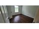 This bedroom offers lots of natural light and dark wood flooring at 341 Brookside Dr, Mcdonough, GA 30253