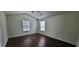 Bright bedroom featuring hardwood floors, neutral walls and ample natural light at 341 Brookside Dr, Mcdonough, GA 30253