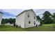Exterior view of the back of the house with ample backyard space at 341 Brookside Dr, Mcdonough, GA 30253