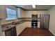 Modern kitchen with granite countertops and stainless steel appliances at 341 Brookside Dr, Mcdonough, GA 30253