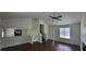 Open-concept living space boasting hardwood floors, neutral walls, and a view of the kitchen at 341 Brookside Dr, Mcdonough, GA 30253