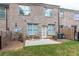 Fenced backyard with patio featuring mature landscaping and outdoor seating at 5535 Bright Cross Way, Suwanee, GA 30024