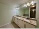 Well-appointed bathroom with double vanity, granite countertops, and a separate shower and tub at 5535 Bright Cross Way, Suwanee, GA 30024