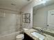 Bathroom with granite countertop, modern fixtures, and tub-shower combo at 5535 Bright Cross Way, Suwanee, GA 30024