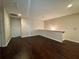 Upstairs bonus room with hardwood floors and plenty of natural light at 5535 Bright Cross Way, Suwanee, GA 30024
