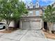 Charming brick townhome with a two-car garage and well-maintained landscaping at 5535 Bright Cross Way, Suwanee, GA 30024