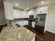 Modern kitchen featuring stainless steel appliances and granite countertops at 5535 Bright Cross Way, Suwanee, GA 30024