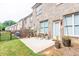 Outdoor patio with chairs and a table surrounded by green grass at 5535 Bright Cross Way, Suwanee, GA 30024