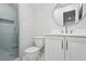 Modern bathroom with glass-enclosed shower and stylish fixtures at 8900 River Trace Dr, Johns Creek, GA 30097