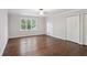 Large bedroom featuring hardwood floors, a ceiling fan and a window with natural light at 8900 River Trace Dr, Johns Creek, GA 30097