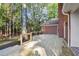 A spacious wooden deck perfect for outdoor dining and relaxing with lush greenery in the background at 8900 River Trace Dr, Johns Creek, GA 30097