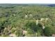 Aerial shot of neighborhood in a forested area with arrow indicating direction of Saddlebrook Swim/Tennis area at 1096 Polo Club Nw Dr, Marietta, GA 30064