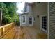 Back deck with outdoor access to a wooded and private backyard space at 1096 Polo Club Nw Dr, Marietta, GA 30064