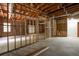 This unfinished basement features concrete flooring, exposed framing and ductwork, and natural light at 1096 Polo Club Nw Dr, Marietta, GA 30064