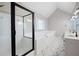 Modern bathroom with a glass shower, soaking tub, dual vanities, and stylish marble floors, ideal for relaxation at 1096 Polo Club Nw Dr, Marietta, GA 30064