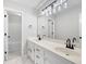 This elegant bathroom features dual sinks, white cabinets, and a subway tile shower/tub combo at 1096 Polo Club Nw Dr, Marietta, GA 30064