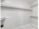 Empty walk-in closet with ample shelving and hanging space to keep clothing and personal items organized at 1096 Polo Club Nw Dr, Marietta, GA 30064