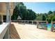 Expansive deck with outdoor seating offers a relaxing spot to enjoy views of the community pool at 1096 Polo Club Nw Dr, Marietta, GA 30064